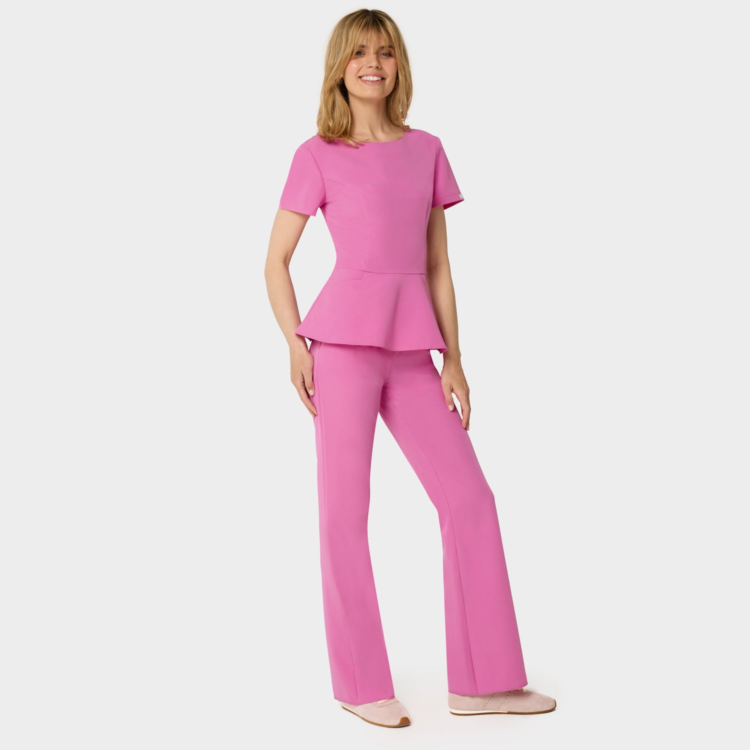 Bluza medyczna damska z baskinką KIM w kolorze Disco Pink - kobieca, taliowana - Vena Uniformy